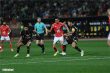 صورة لحكام كرة قدم في الملعب خلال مباراة بين الأهلي والزمالك